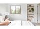 Bright bedroom with a built-in shelf, a window, and neutral decor at 1272 S Milwaukee St, Denver, CO 80210