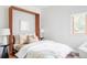 Comfortable bedroom with a murphy bed, a window, and neutral decor at 1272 S Milwaukee St, Denver, CO 80210