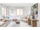 Sunny bedroom with twin beds, natural light, and an accent chair at 1272 S Milwaukee St, Denver, CO 80210