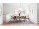Bright dining room featuring a modern light fixture and large windows at 1272 S Milwaukee St, Denver, CO 80210