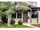 Charming brick home featuring a well-manicured lawn and freshly painted door and trim at 1272 S Milwaukee St, Denver, CO 80210