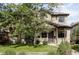 Charming two-story home with a well-manicured lawn and mature tree in a desirable neighborhood at 1272 S Milwaukee St, Denver, CO 80210