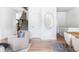 Hallway connecting multiple rooms featuring a staircase, neutral paint, and wood floors at 1272 S Milwaukee St, Denver, CO 80210