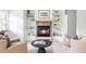 Inviting living room with a cozy fireplace and built-in bookshelves at 1272 S Milwaukee St, Denver, CO 80210
