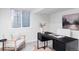 Bright home office featuring a large window, modern desk, and comfortable chair at 1272 S Milwaukee St, Denver, CO 80210