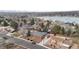 Charming brick home near a frozen lake, showcasing a serene neighborhood and mountain view at 4731 W 66Th Ave, Arvada, CO 80003