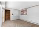 Spacious basement room with neutral carpet and a walk-in closet, offering potential for customization at 4731 W 66Th Ave, Arvada, CO 80003