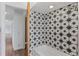 Shower stall with patterned tilework and a white tub at 4731 W 66Th Ave, Arvada, CO 80003