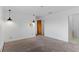Spacious bedroom with neutral carpet, modern lighting fixtures, and an ensuite bathroom at 4731 W 66Th Ave, Arvada, CO 80003