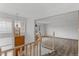 Bright entryway featuring wood floors, an ornate lantern, and open access to the living room at 4731 W 66Th Ave, Arvada, CO 80003