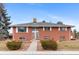 Charming brick home with a well-manicured lawn and inviting entrance, perfect for a Gathering at 4731 W 66Th Ave, Arvada, CO 80003