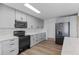 Elegant kitchen featuring sleek gray cabinetry, modern appliances, and ample counter space, ideal for cooking at 4731 W 66Th Ave, Arvada, CO 80003