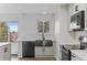 Bright kitchen with stainless steel sink, modern appliances, and subway tile backsplash, move-in ready! at 4731 W 66Th Ave, Arvada, CO 80003