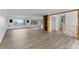 Open living area with hardwood floors, built-in shelving, and large windows offers abundant natural light at 4731 W 66Th Ave, Arvada, CO 80003