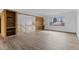 Bright, open-concept living room with wood floors and large windows, creating a welcoming atmosphere at 4731 W 66Th Ave, Arvada, CO 80003