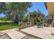 A spacious backyard with a patio, lawn, and lush greenery for outdoor enjoyment and relaxation at 20596 E Shefield Ct, Parker, CO 80138