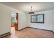 Bright dining room with hardwood floors, a window, and a view into the kitchen at 20596 E Shefield Ct, Parker, CO 80138