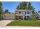 Lovely two-story home with a well-maintained lawn, a charming covered entry, and an attached two-car garage at 20596 E Shefield Ct, Parker, CO 80138
