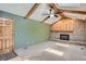 Bright living room with vaulted ceiling, skylights, ceiling fan and a brick fireplace at 20596 E Shefield Ct, Parker, CO 80138