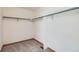 A spacious walk-in closet with multiple shelves for optimal storage solutions and organized space at 20596 E Shefield Ct, Parker, CO 80138