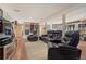 Spacious finished basement with plush leather seating, a cozy rug, and ample space for entertainment at 7605 Shenandoah Dr, Elizabeth, CO 80107