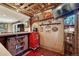 Finished basement bar showcasing unique lighting, shelving, and decor, perfect for a home entertainment space at 7605 Shenandoah Dr, Elizabeth, CO 80107