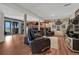Finished basement showcasing comfortable leather seating, entertainment area, and sliding doors to the outdoors at 7605 Shenandoah Dr, Elizabeth, CO 80107