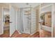 Modern bathroom featuring a glass block shower, updated fixtures, and access from the main bedroom at 7605 Shenandoah Dr, Elizabeth, CO 80107