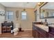 Well-lit bathroom featuring a dark vanity, ample storage, and stylish fixtures for a spa-like experience at 7605 Shenandoah Dr, Elizabeth, CO 80107