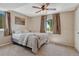 Cozy bedroom featuring a comfortable bed, soft carpet, and ample natural light from the windows at 7605 Shenandoah Dr, Elizabeth, CO 80107