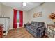 Comfortable bedroom with hardwood floors, soft lighting, and a relaxing ambiance for peaceful relaxation at 7605 Shenandoah Dr, Elizabeth, CO 80107