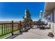Enjoy outdoor living on this large deck with beautiful views, complete with patio furniture and shade umbrellas at 7605 Shenandoah Dr, Elizabeth, CO 80107
