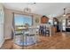 This eat-in kitchen features an island, a dining table with views, and plenty of cabinet space at 7605 Shenandoah Dr, Elizabeth, CO 80107