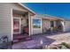 This home has a welcoming stone exterior, colorful door, and charming landscaping at 7605 Shenandoah Dr, Elizabeth, CO 80107