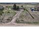 Picturesque property featuring a long driveway leading to a charming home and outbuildings on a spacious lot at 7605 Shenandoah Dr, Elizabeth, CO 80107