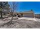 Charming home with stone accents, two car garage and mature trees in the front yard at 7605 Shenandoah Dr, Elizabeth, CO 80107