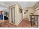 Basement hallway leading to entertainment spaces with modern flooring and stylish decor at 7605 Shenandoah Dr, Elizabeth, CO 80107