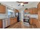 A well-equipped kitchen with stainless steel appliances, wooden cabinetry, and ample counter space at 7605 Shenandoah Dr, Elizabeth, CO 80107
