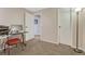 This neutral carpeted office includes a desk, computer, and printer, with doorways leading to other rooms at 7605 Shenandoah Dr, Elizabeth, CO 80107