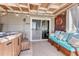 Inviting sunroom with a hot tub, cozy seating, and views of the surrounding landscape, perfect for relaxation at 7605 Shenandoah Dr, Elizabeth, CO 80107