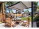Inviting outdoor patio with pergola, comfortable seating, hammock, and well-maintained backyard at 142 N Logan St, Denver, CO 80203