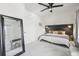 Bright bedroom features a full-length mirror, a sleek headboard, and a soft color palette at 142 N Logan St, Denver, CO 80203