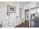 Butler Pantry displays bright white cabinets and drawers for storing glassware and barware at 142 N Logan St, Denver, CO 80203