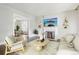Bright living room boasts fireplace, hardwood floors, neutral paint, and light filled dining room at 142 N Logan St, Denver, CO 80203