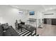 Well-lit living area with TV, wet bar, dark cabinets, and modern decor. Perfect for relaxation at 142 N Logan St, Denver, CO 80203