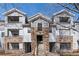 Attractive exterior view of a multi-Gathering home with stone accents, balconies, and well-maintained landscaping at 5255 Memphis St # 1112, Denver, CO 80239