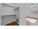 Empty walk-in closet with wood-look flooring and wire shelving at 5255 Memphis St # 1112, Denver, CO 80239