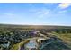 Community aerial view showcasing pool, club house, and surrounding neighborhood with stunning mountain backdrop at 455 Rogers Way, Castle Rock, CO 80104