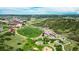 Aerial view features community park with a soccer field, playground, parking lot, and recreational areas at 455 Rogers Way, Castle Rock, CO 80104