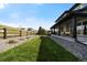 Inviting backyard featuring a covered patio and green lawn at 455 Rogers Way, Castle Rock, CO 80104